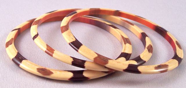 LG101 set three 60s lucite striped spacer bangles